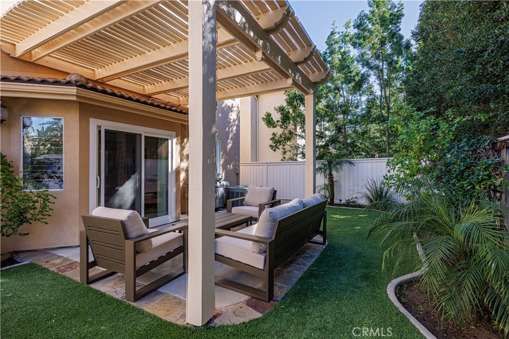 14 Sorenson Irvine, CA 92602 - Photo 24 of 29 a view of a house with backyard sitting area and garden