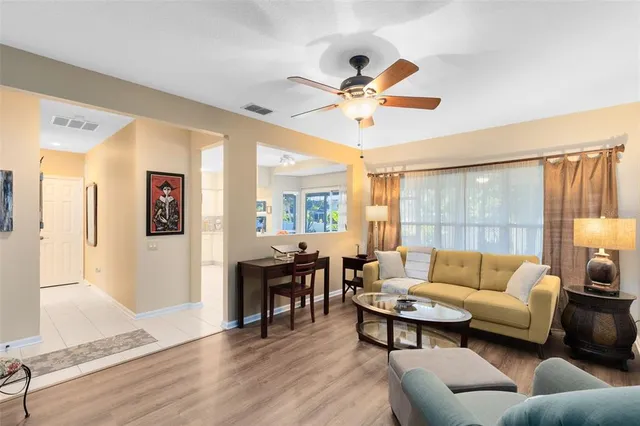a living room with furniture and a large window