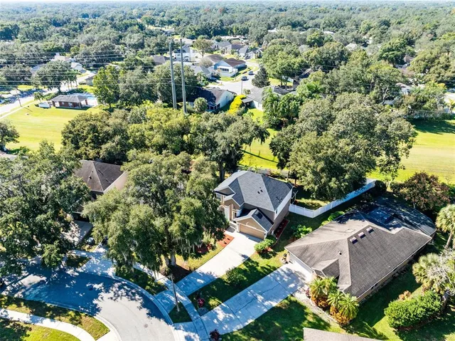 an aerial view of residential house with outdoor space and swimming pool