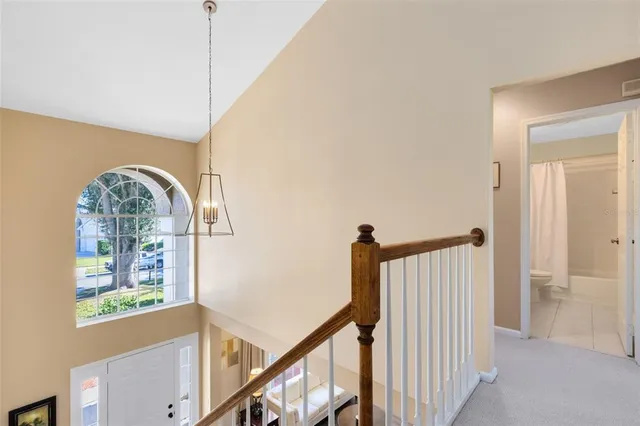 a view of entryway with wooden floor and window