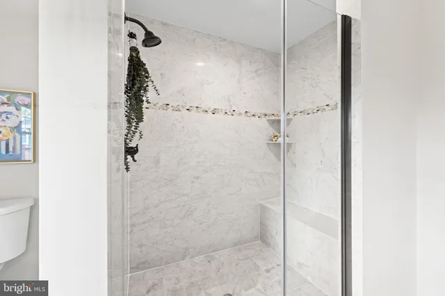 a bathroom with a sink vanity and a mirror