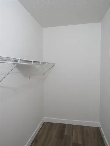 a view of a room with racks on the wall