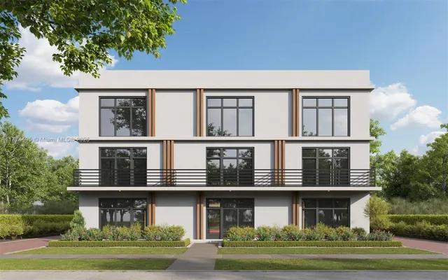 front view of a brick house with a yard