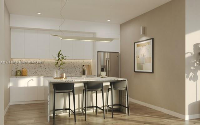 630 Northeast 3rd Street Hallandale Beach, FL 33009 - Photo 6 of 13 a view of a dining room with furniture and wooden floor