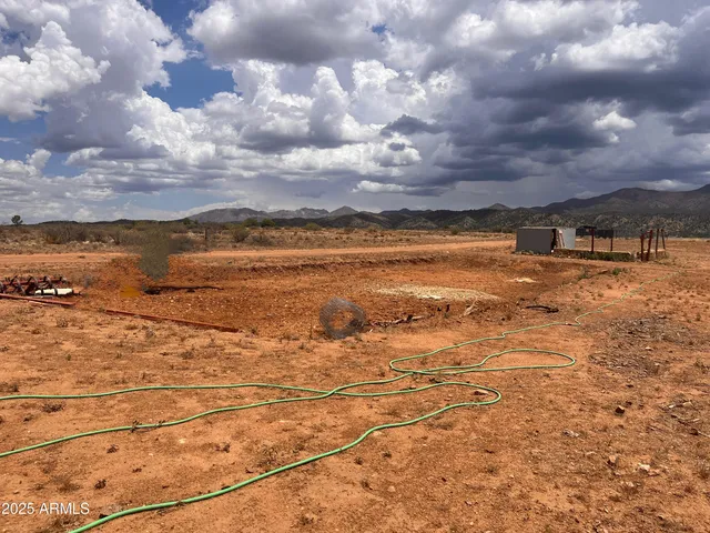 a view of an ocean beach and mountain