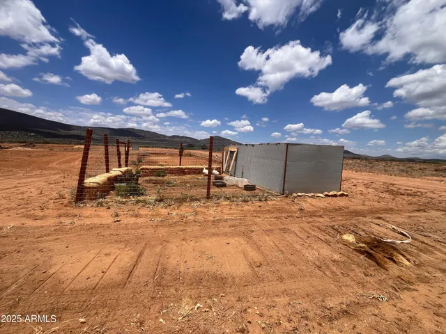 a view of a backyard of the house