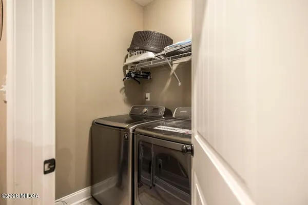 a room with gym equipment and a flat screen tv