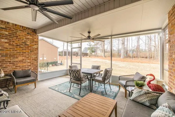 a view of a house with wooden fence