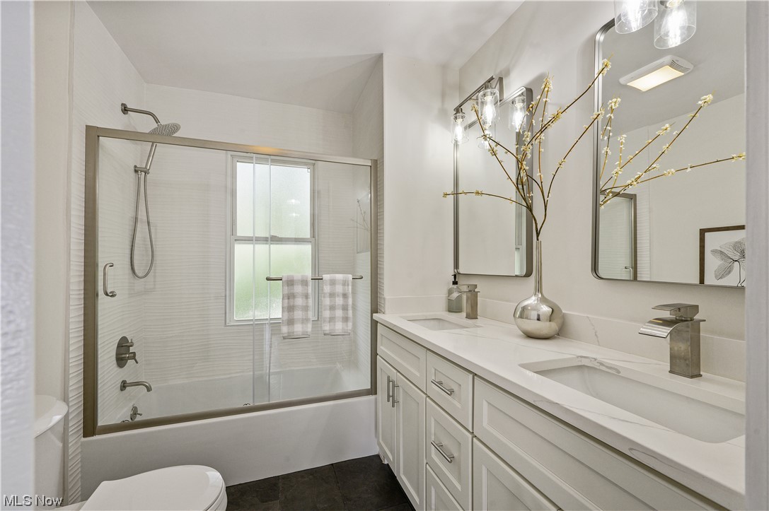 1606 Maple Road Cleveland Heights, OH 44121 - Photo 18 of 30 The 2nd floor offers 3 spacious bedrooms and newly updated full bathroom(2023) features bathtub, sliding shower doors, double sink vanity.