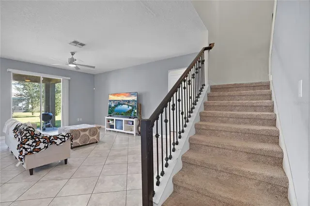 a living room with furniture and windows
