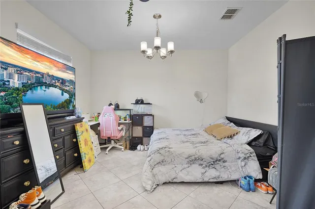a bedroom with a bed furniture and a window