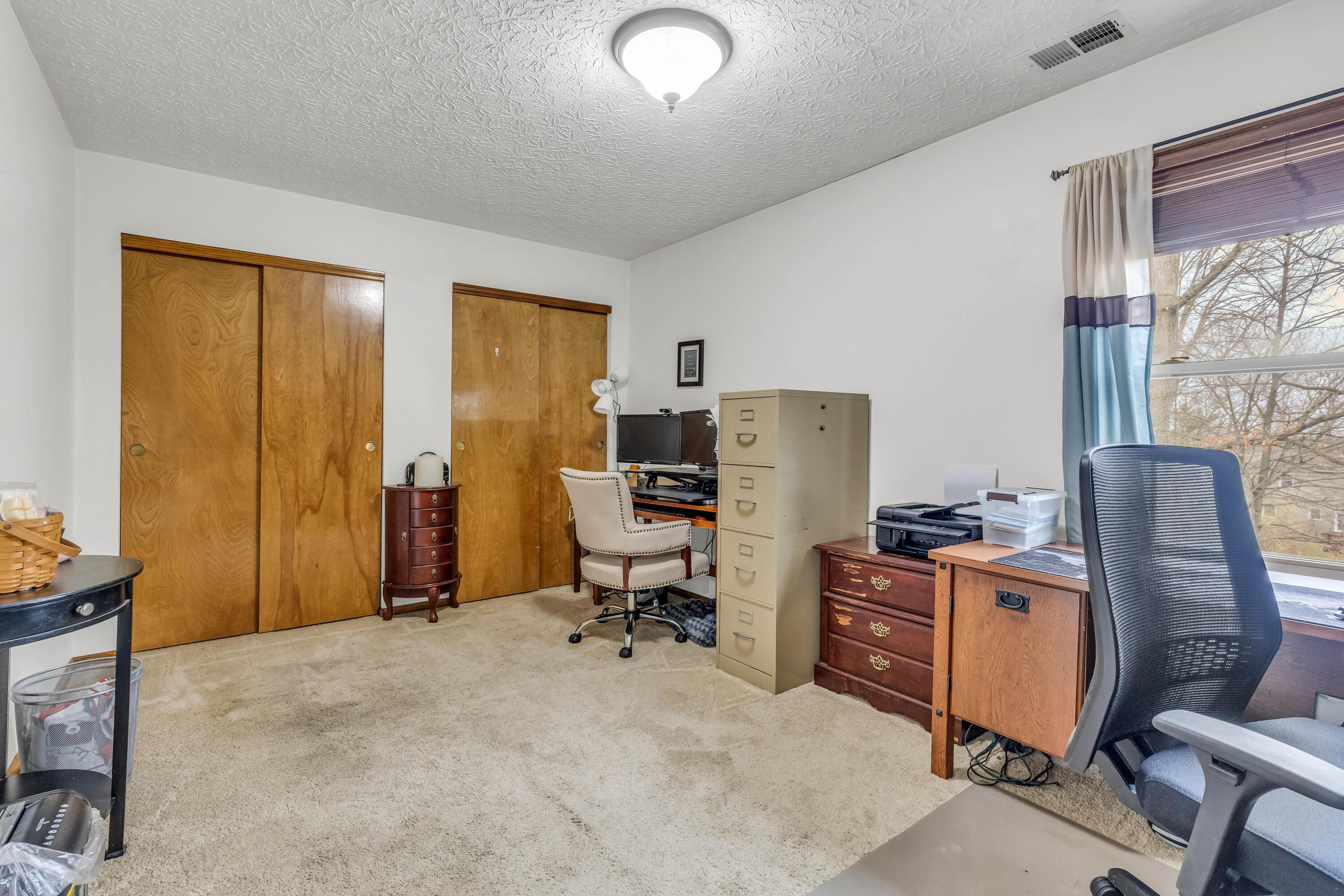 435 Emory Street Gahanna, OH 43230 - Photo 30 of 54 • Light sand carpet
• Ivory painted walls
• Ceiling light
• 2 door closet with
double sliding doors
• Drapes