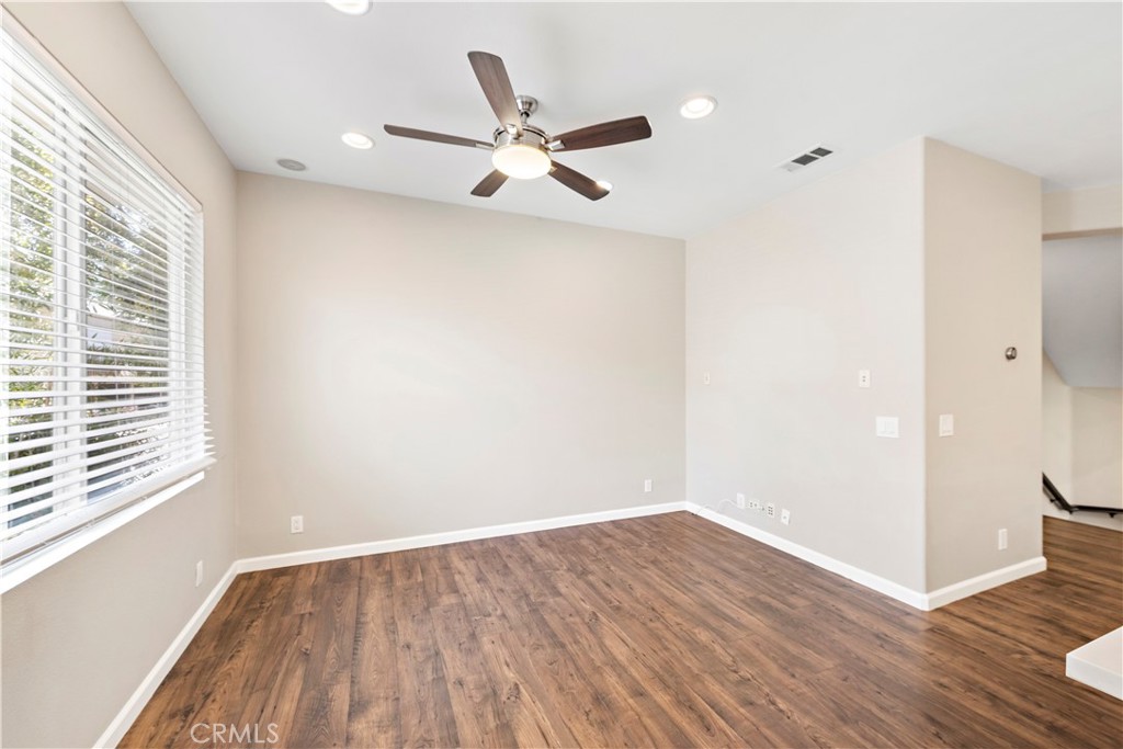 158 North Brea Boulevard Brea, CA 92821 - Photo 12 of 22 a view of an empty room with wooden floor and a window