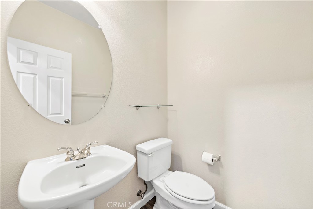 158 North Brea Boulevard Brea, CA 92821 - Photo 13 of 22 a bathroom with a toilet a sink and mirror