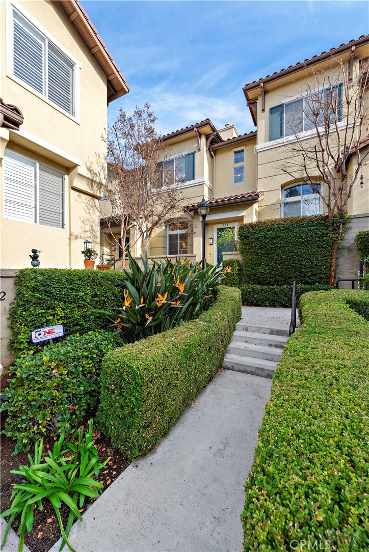 158 North Brea Boulevard Brea, CA 92821 - Photo 2 of 22 a view of a house with a yard and potted plants