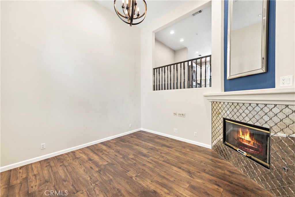 158 North Brea Boulevard Brea, CA 92821 - Photo 6 of 22 a view of an empty room with wooden floor and a window