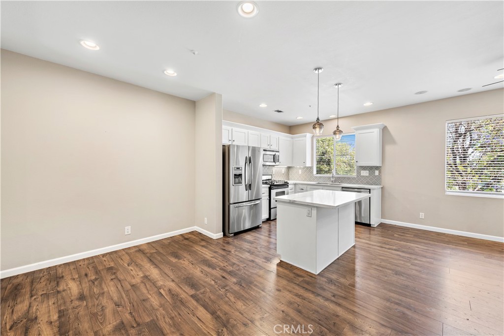 158 North Brea Boulevard Brea, CA 92821 - Photo 9 of 22 a kitchen with a refrigerator and a sink