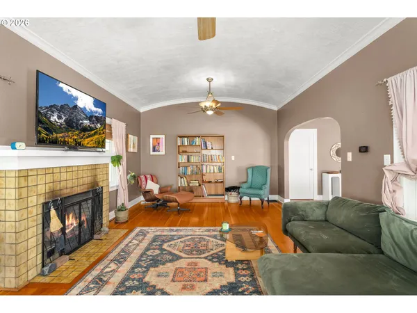 a living room with furniture and a fireplace