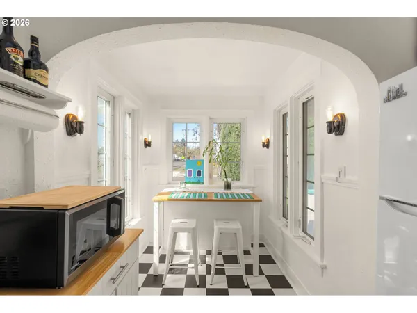 a kitchen with a sink a stove and a refrigerator