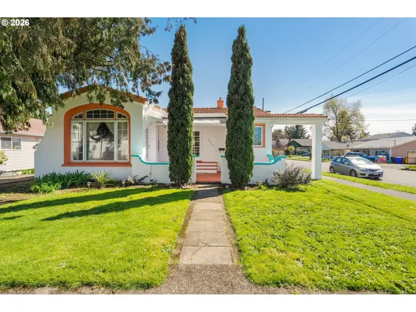 a front view of a house with garden