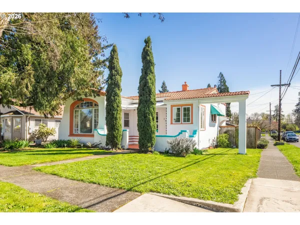 a front view of a house with garden