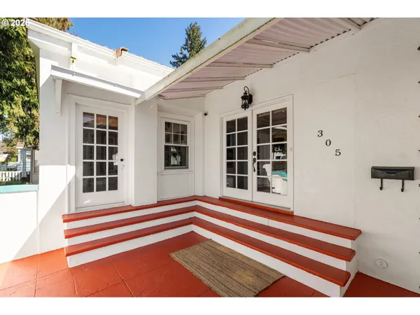 a view of wooden door and a balcony