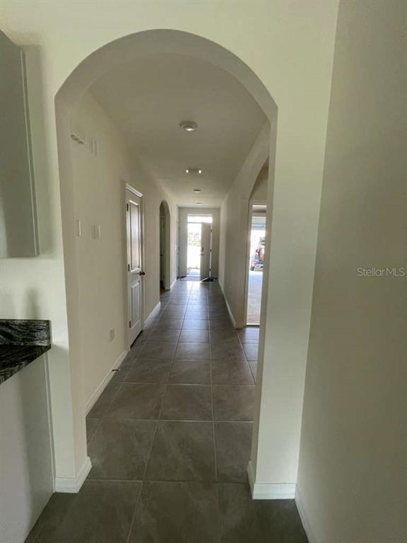 8954 Forge Breeze Loop Wesley Chapel, FL 33545 - Photo 16 of 37 a view of a hallway