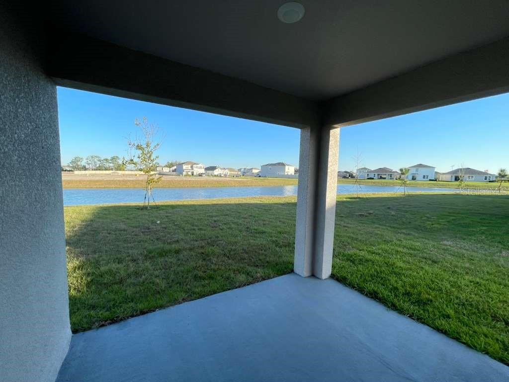 8954 Forge Breeze Loop Wesley Chapel, FL 33545 - Photo 18 of 37 a view of a field with an ocean view