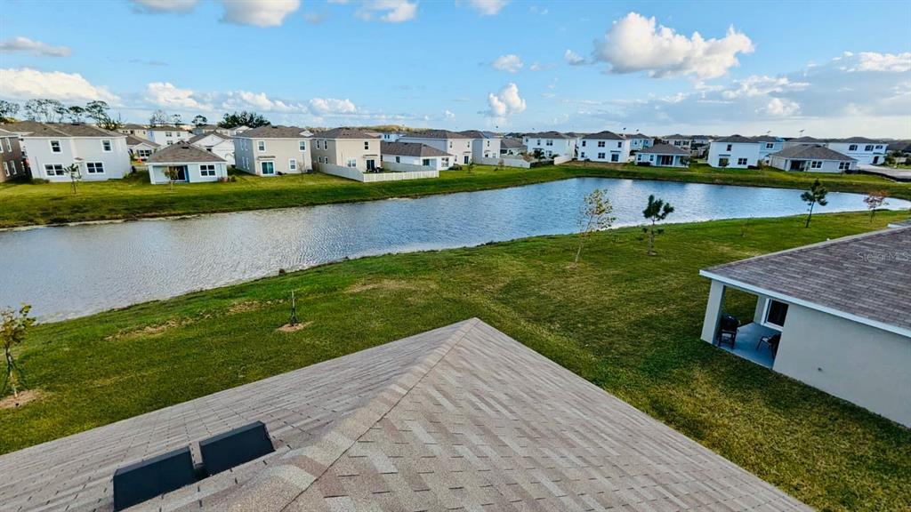 8954 Forge Breeze Loop Wesley Chapel, FL 33545 - Photo 21 of 37 a view of a lake with houses