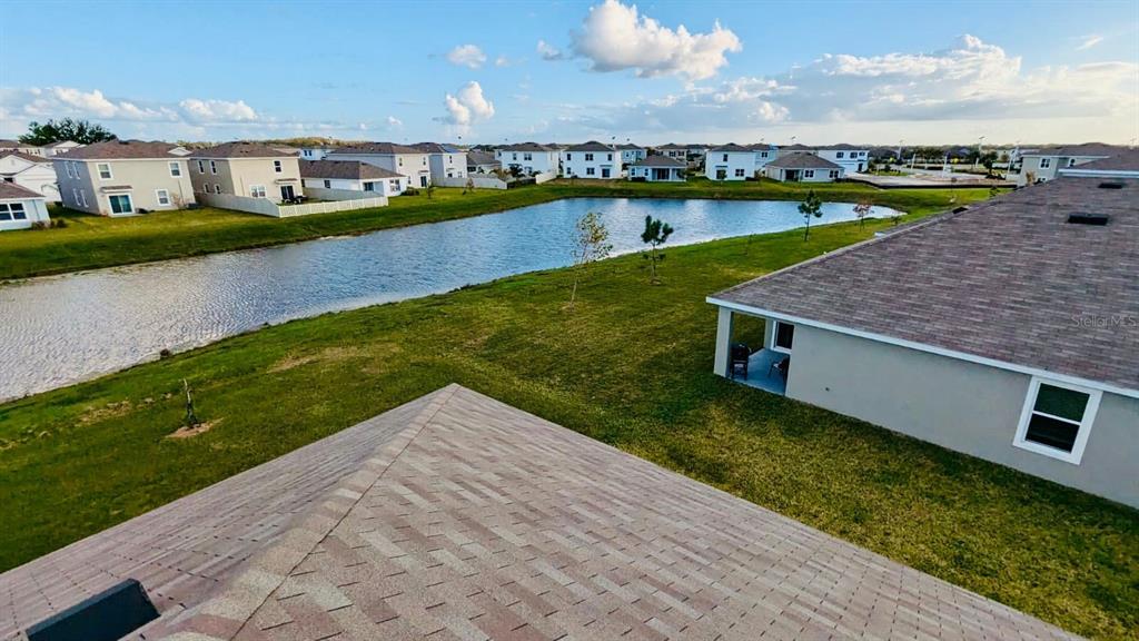 8954 Forge Breeze Loop Wesley Chapel, FL 33545 - Photo 22 of 37 a view of a house with a yard