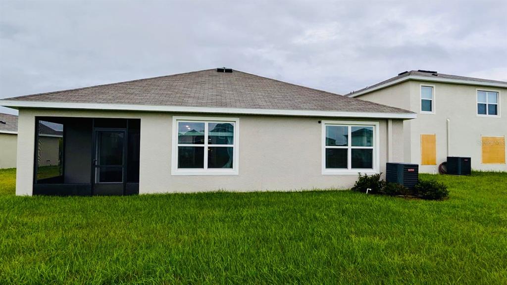 8954 Forge Breeze Loop Wesley Chapel, FL 33545 - Photo 23 of 37 a house view with a garden space
