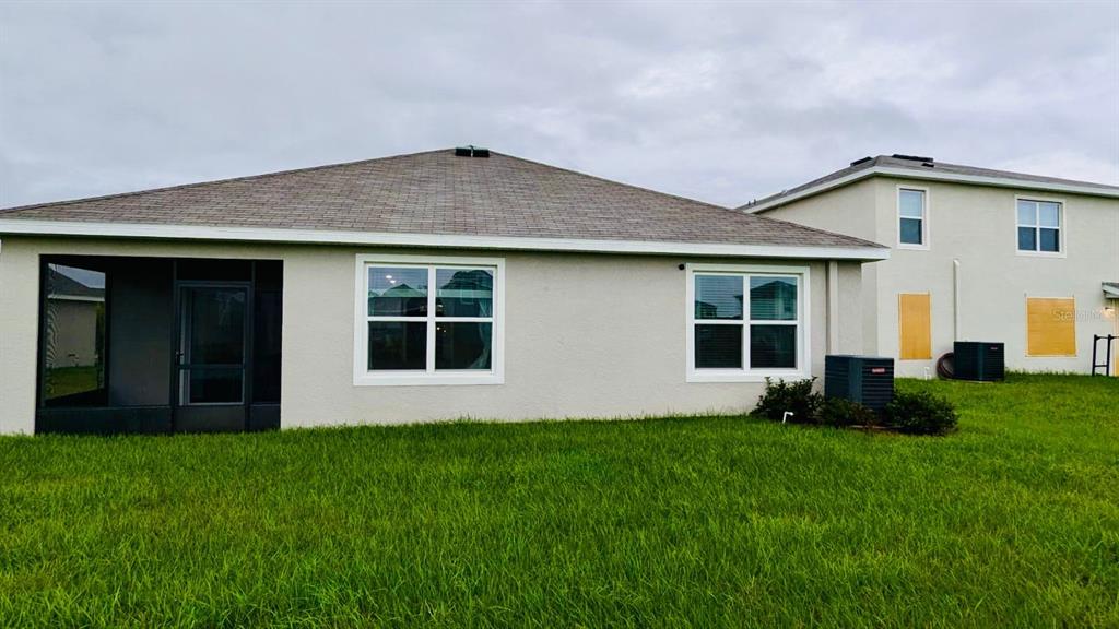 8954 Forge Breeze Loop Wesley Chapel, FL 33545 - Photo 25 of 37 a house view with a garden space