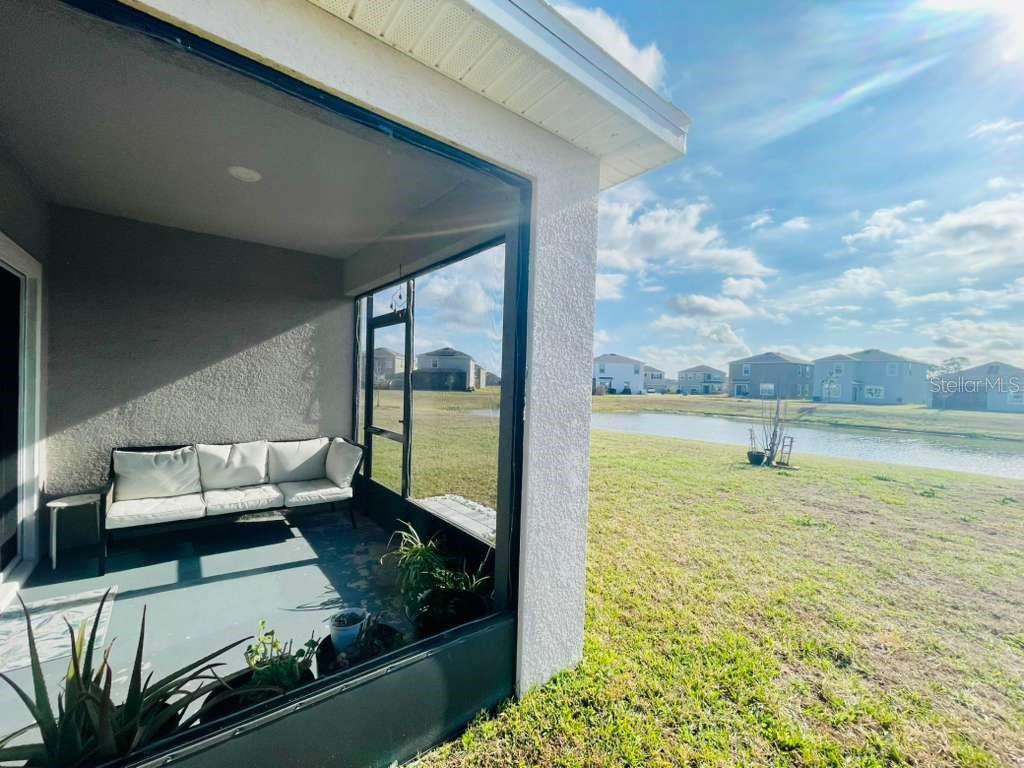 8954 Forge Breeze Loop Wesley Chapel, FL 33545 - Photo 26 of 37 a living room with couch