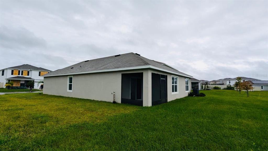 8954 Forge Breeze Loop Wesley Chapel, FL 33545 - Photo 27 of 37 a house view with a garden space