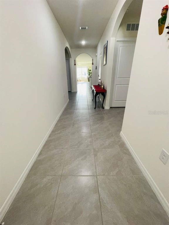 8954 Forge Breeze Loop Wesley Chapel, FL 33545 - Photo 30 of 37 a view of a hallway with seating area