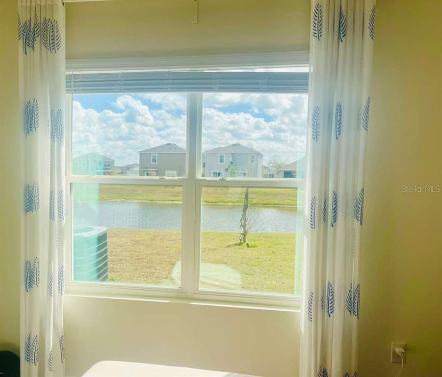 8954 Forge Breeze Loop Wesley Chapel, FL 33545 - Photo 37 of 37 a view of a glass door