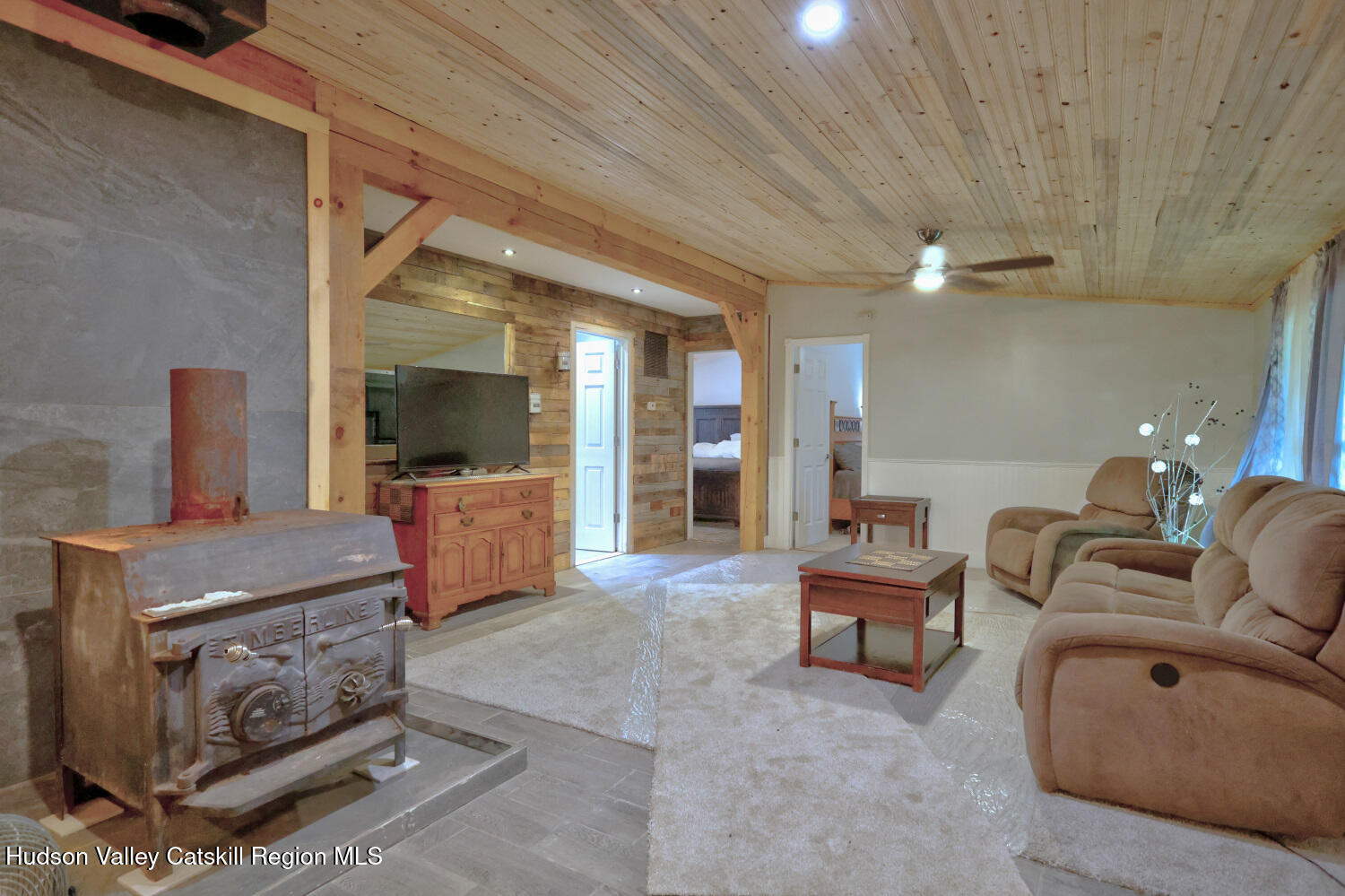141 Jones Road Round Top, NY 12473 - Photo 22 of 70 a living room with furniture and a chandelier