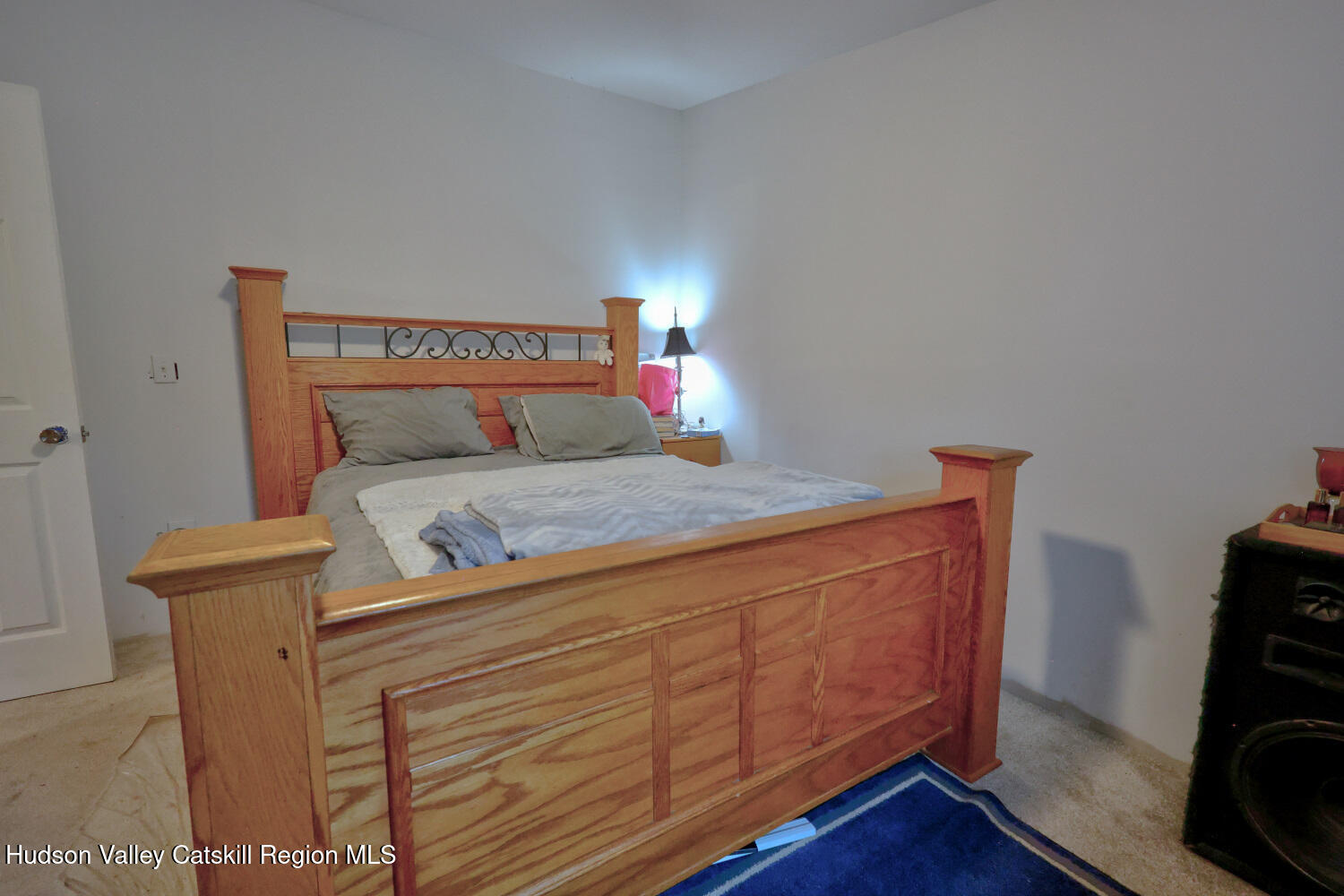 141 Jones Road Round Top, NY 12473 - Photo 28 of 70 a bedroom with a bed and wooden floor