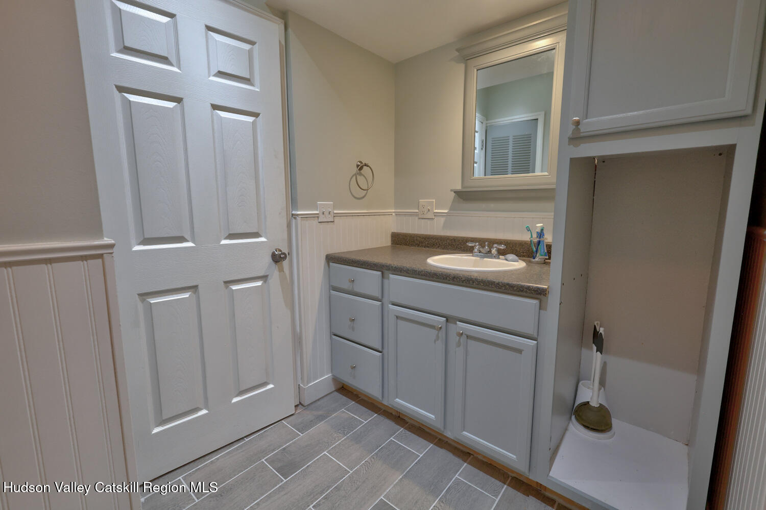 141 Jones Road Round Top, NY 12473 - Photo 31 of 70 a bathroom with a sink and mirror