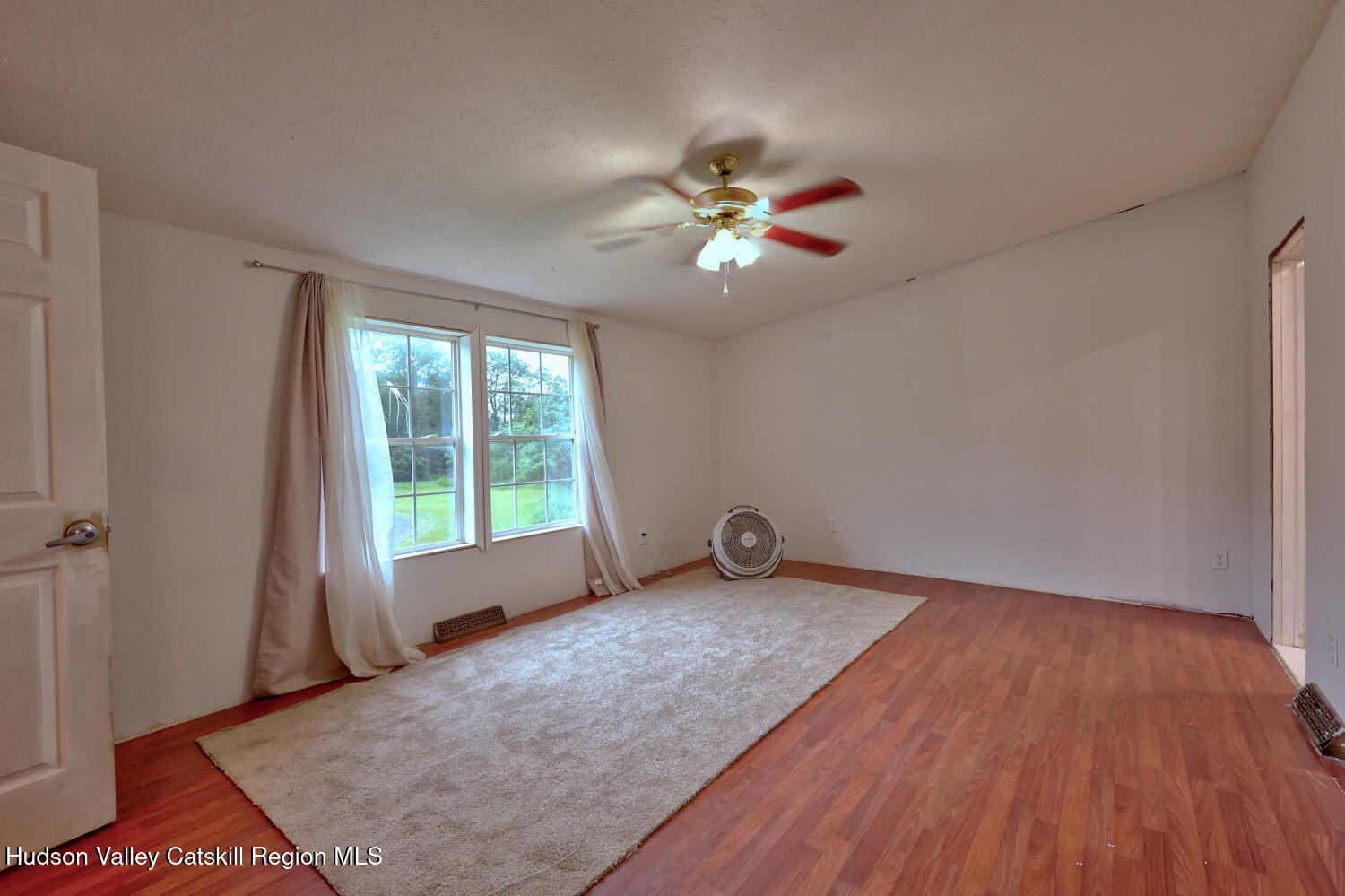 141 Jones Road Round Top, NY 12473 - Photo 45 of 70 wooden floor in an empty room with a window