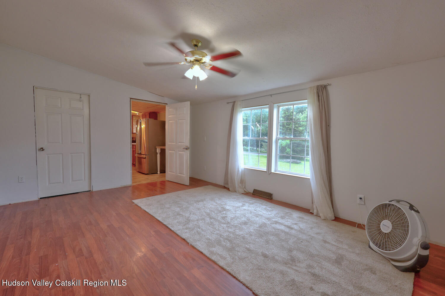141 Jones Road Round Top, NY 12473 - Photo 46 of 70 a view of an empty room with window and wooden floor
