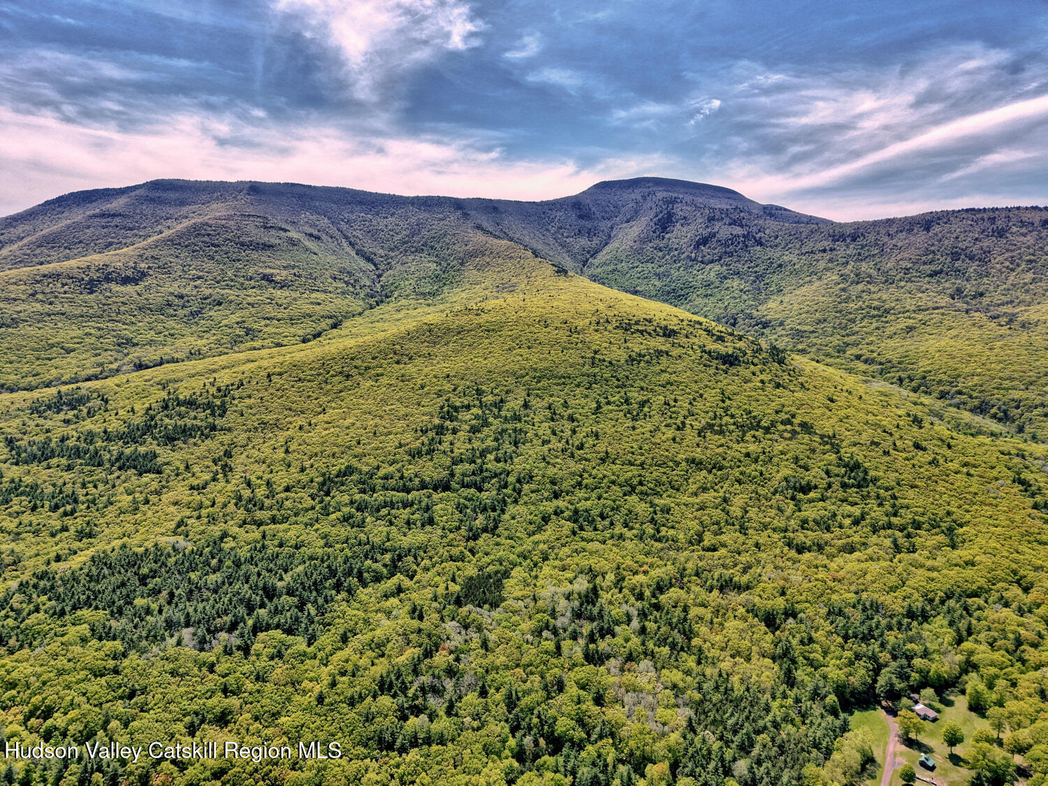 141 Jones Road Round Top, NY 12473 - Photo 61 of 70 a view of a field with mountains in the background