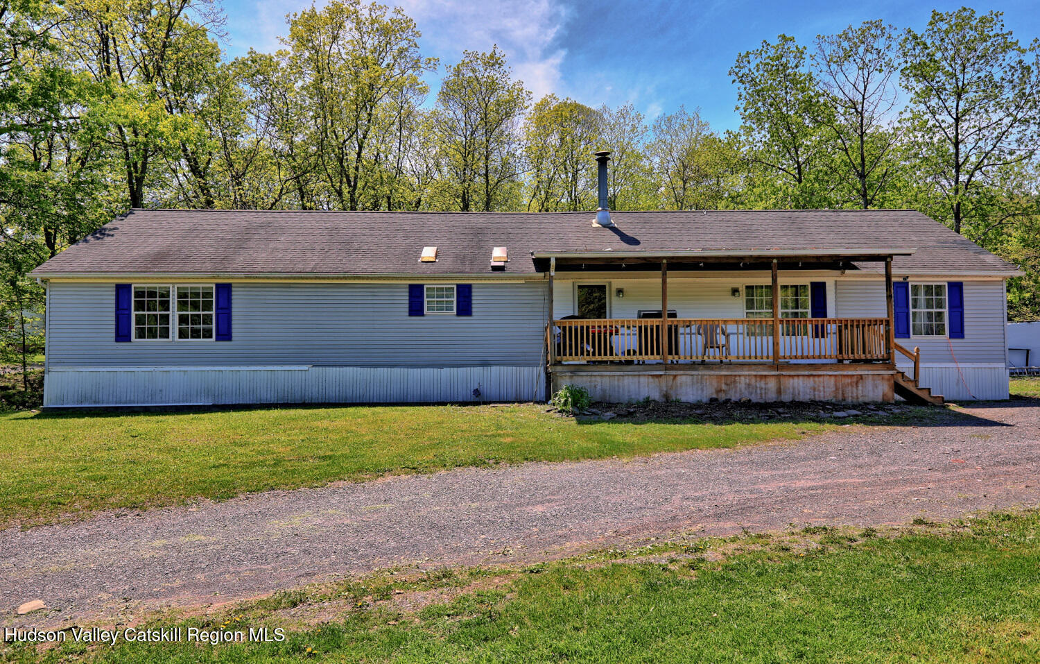 141 Jones Road Round Top, NY 12473 - Photo 68 of 70 a front view of a house with a yard and garage
