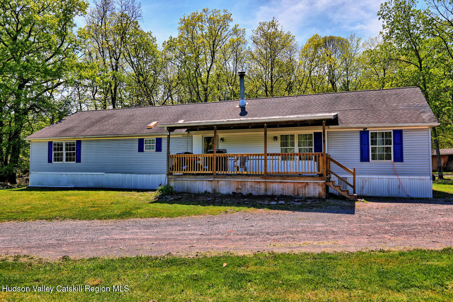 141 Jones Road Round Top, NY 12473 - Photo 70 of 70 a front view of a house with a garden and trees