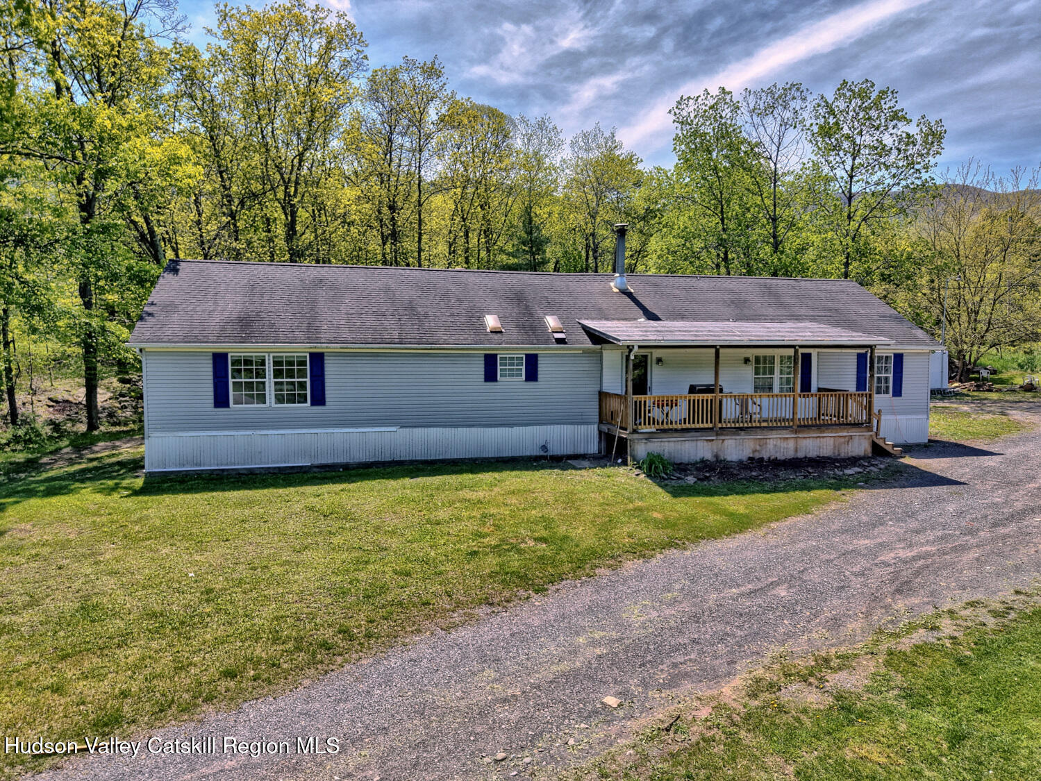 141 Jones Road Round Top, NY 12473 - Photo 9 of 70 a front view of a house with garden