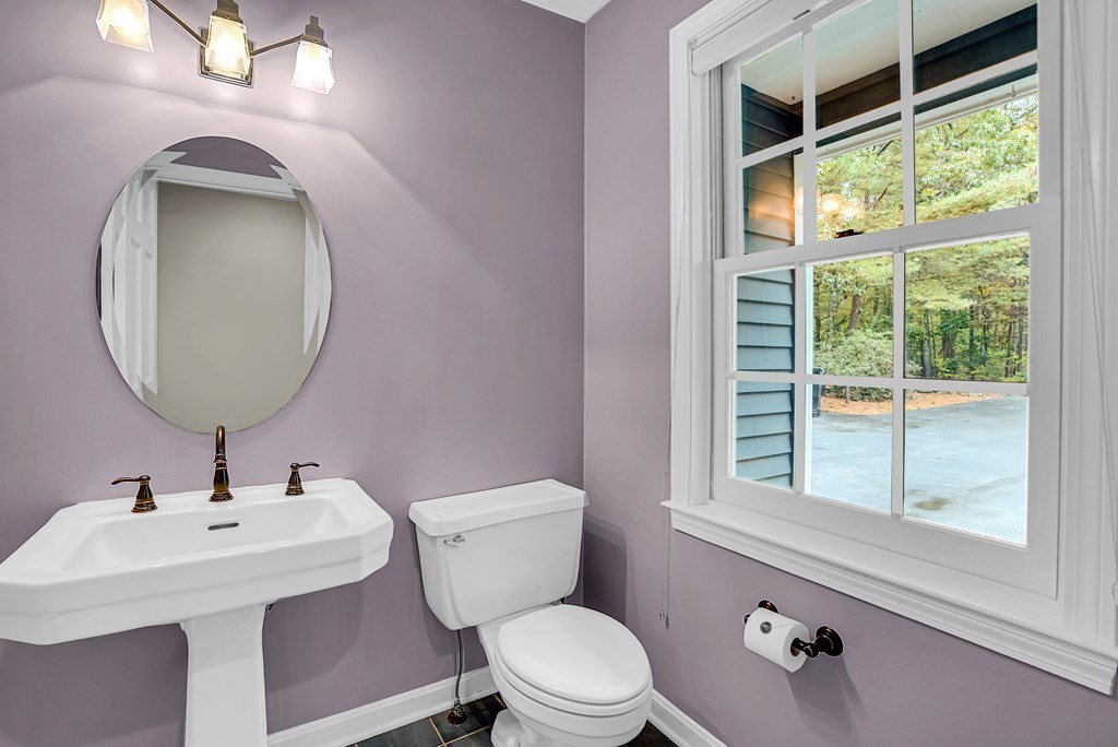 41 South Street Upton, MA 01568 - Photo 20 of 41 a bathroom with a toilet sink and mirror