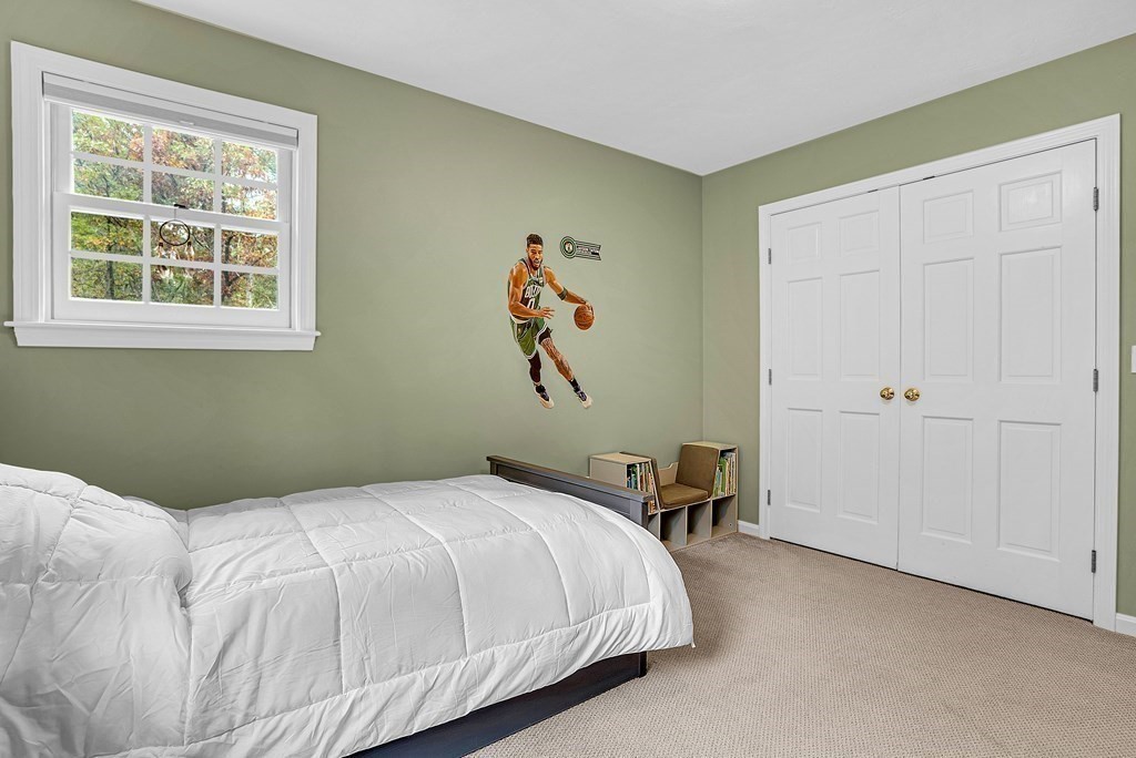 41 South Street Upton, MA 01568 - Photo 29 of 41 a bedroom with a bed and a chair