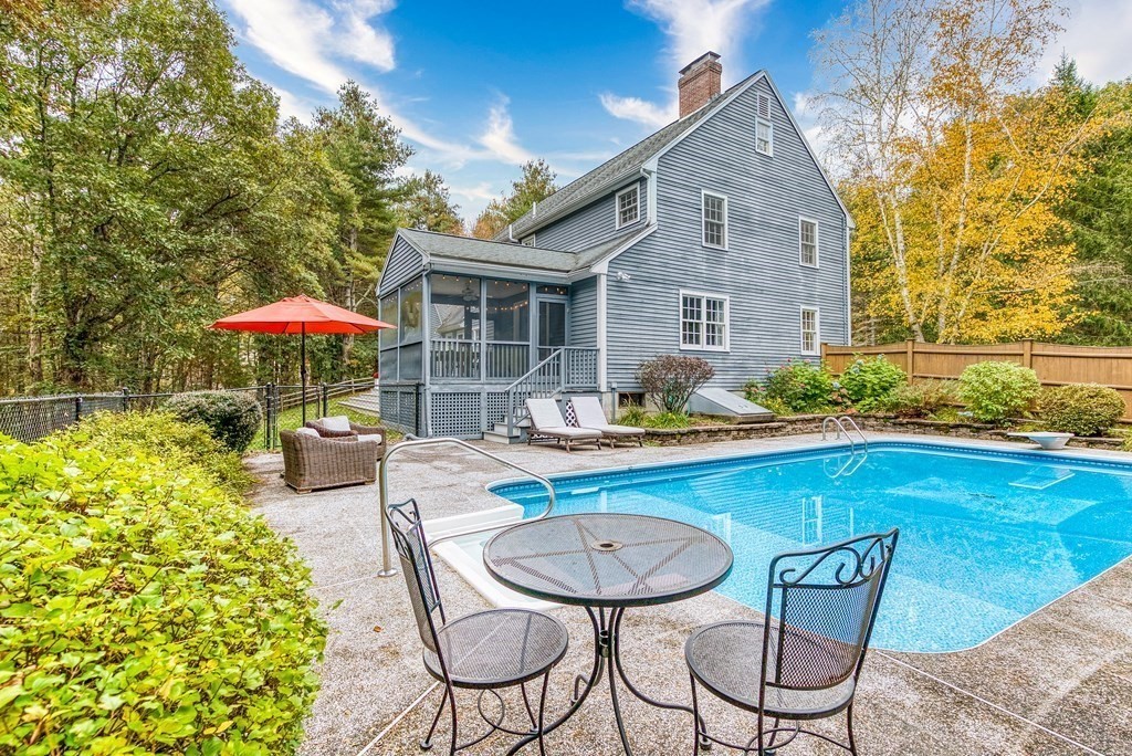 41 South Street Upton, MA 01568 - Photo 32 of 41 a view of a chair and table in the patio with a fire pit