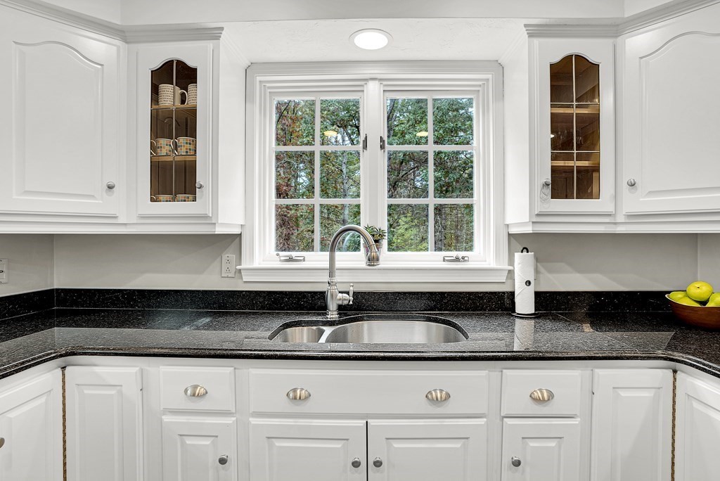 41 South Street Upton, MA 01568 - Photo 4 of 41 a kitchen with granite countertop white cabinets and a window