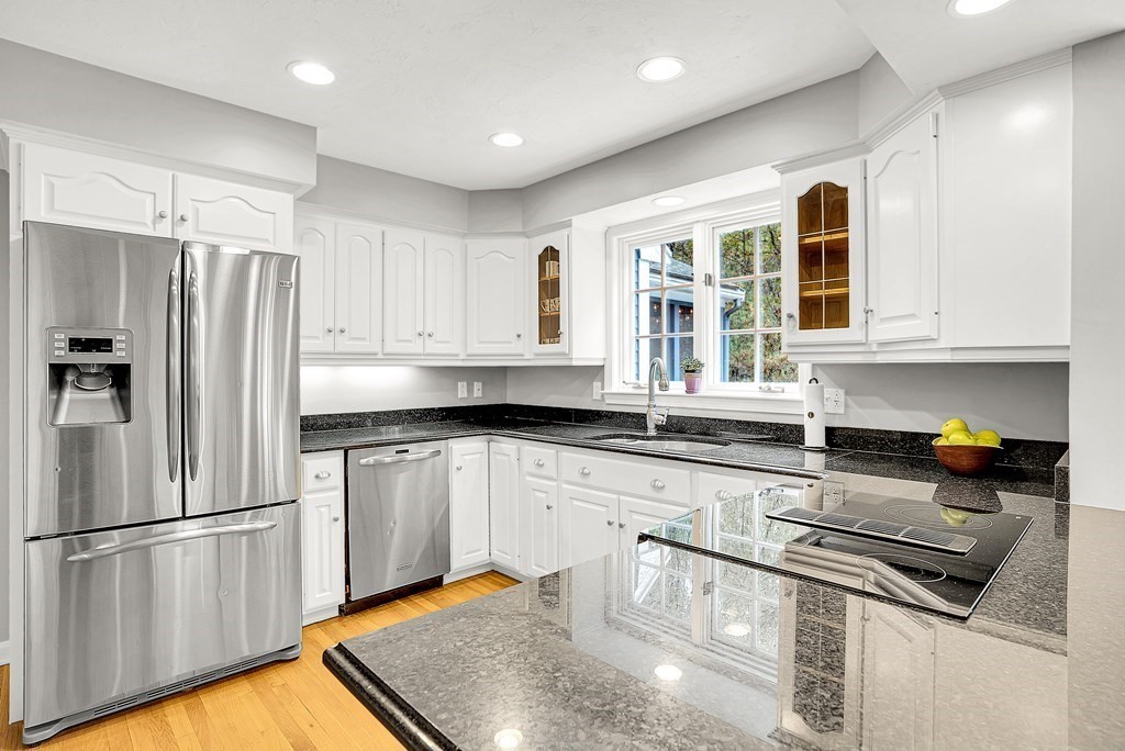 41 South Street Upton, MA 01568 - Photo 5 of 41 a kitchen with stainless steel appliances granite countertop a refrigerator a sink and white cabinets